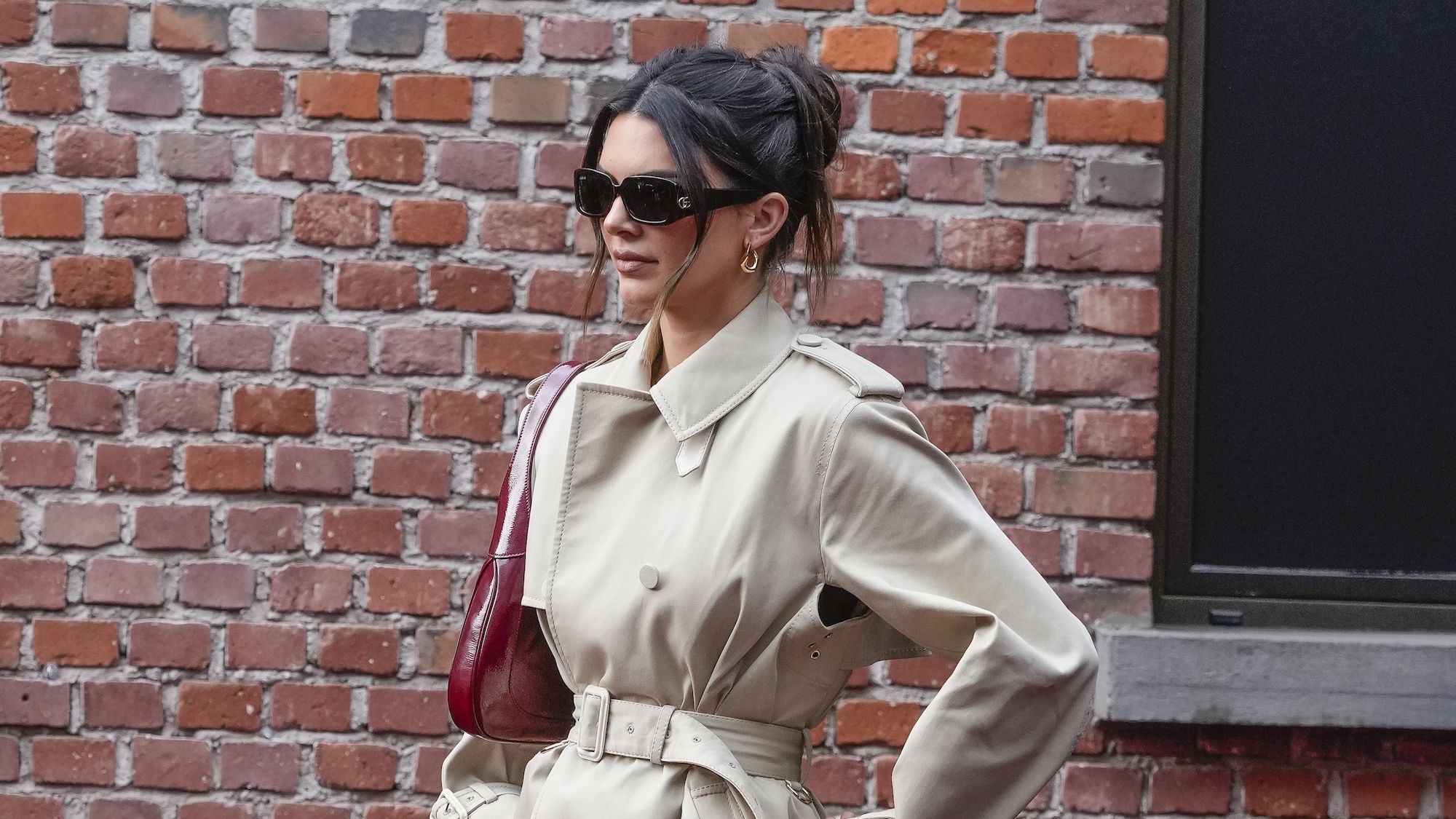 Kendall tucked her trench coat into her skirt in Paris