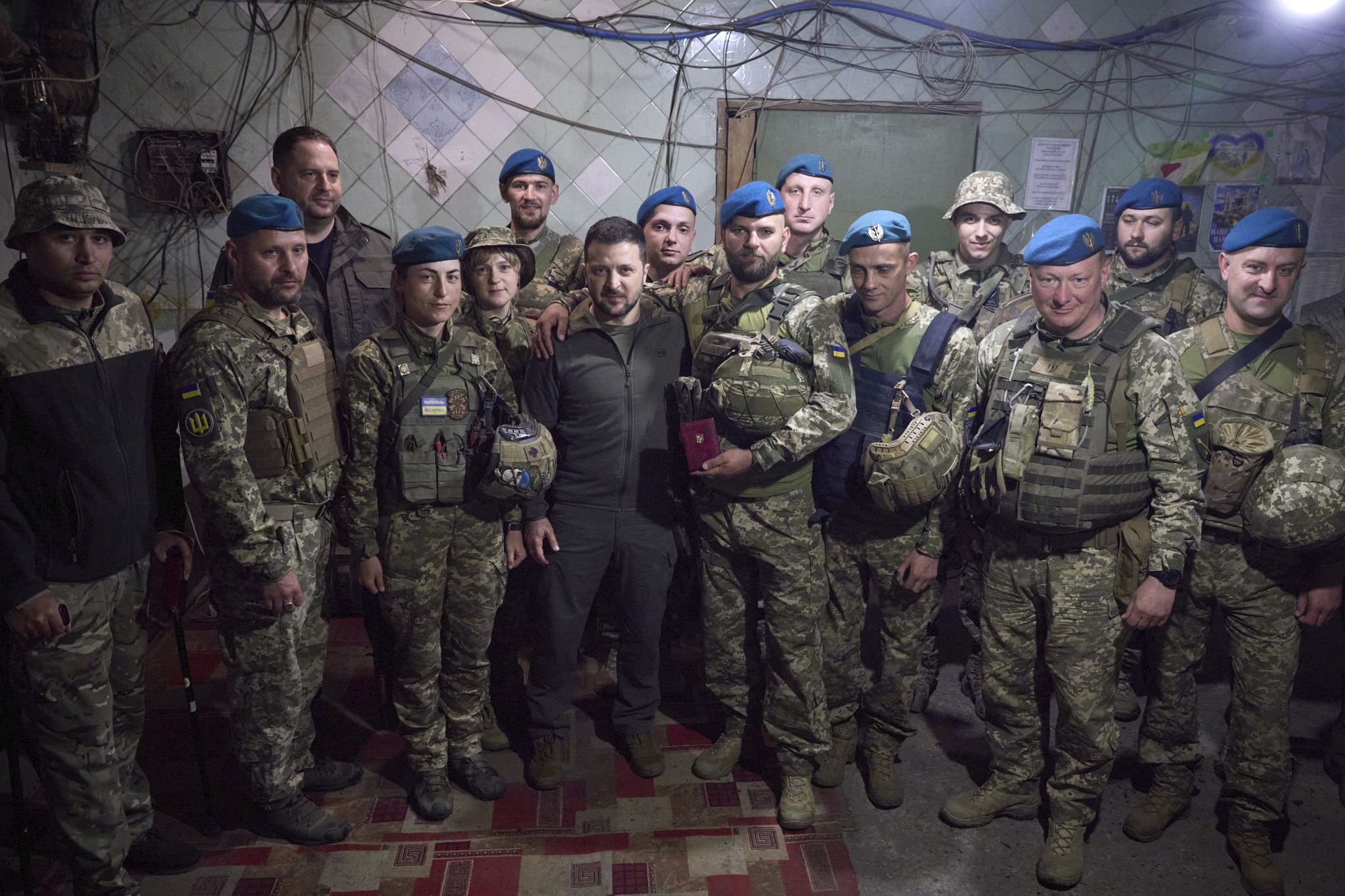 in this photo provided by the ukrainian presidential press office, ukrainian president volodymyr zelenskyy, centre, poses for photo with soldiers after an awarding ceremony as he visits the donetsk region, ukraine, tuesday, may 23, 2023 ukrainian presidential press office via ap