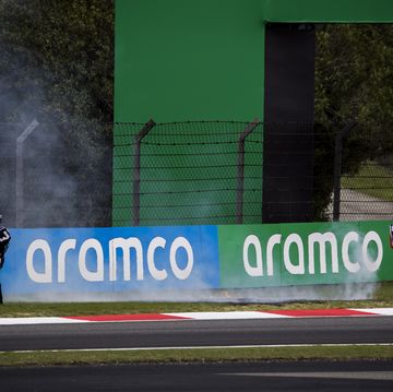 marshals rush to put out the fire on the grass during the formula 1 chinese grand prix in shanghai, china photo by sam bloxhammotorsport imagessipa usa france out, uk outsipa via ap images