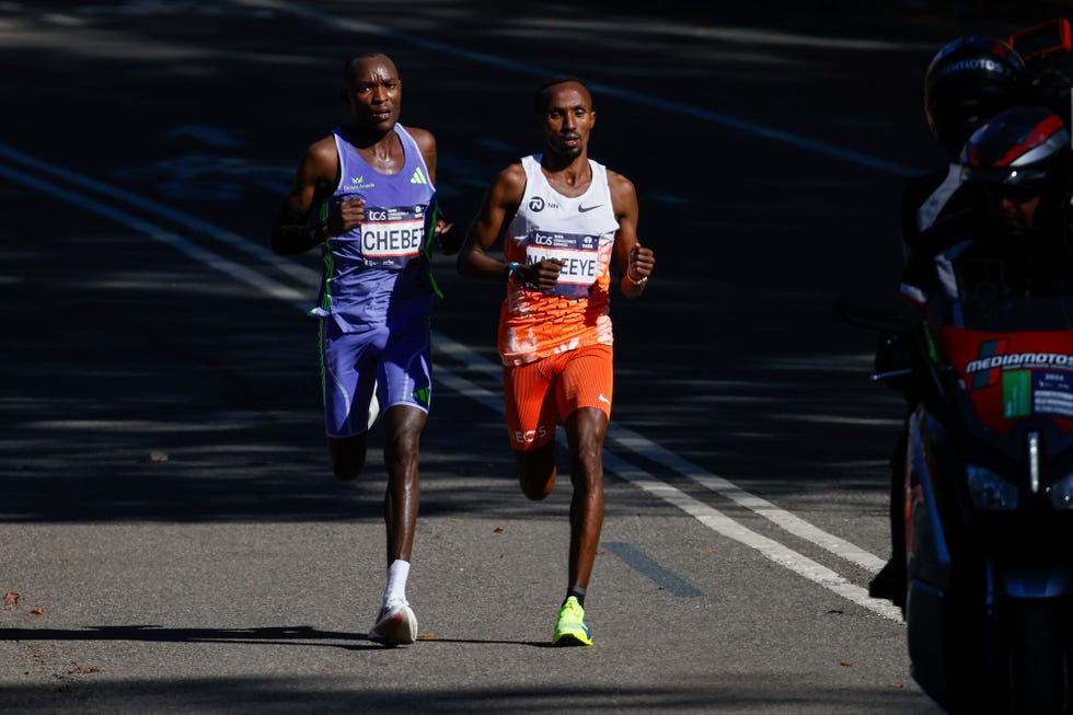 two runners racing at the end of a marathon