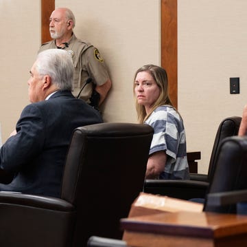 Jodi Hildebrandt in court, December 2023 a woman sitting in a courtroom surrounded by lawyers and police officers