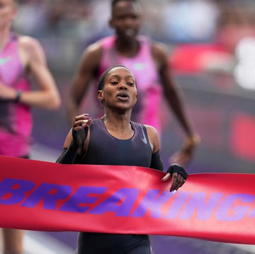 France Athletics Kipyegon 4 Minute Mile Quest a runner breaks finishing tape reading breaking4 with a nike logo