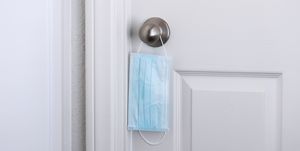 protective mask hanging on a doorknob