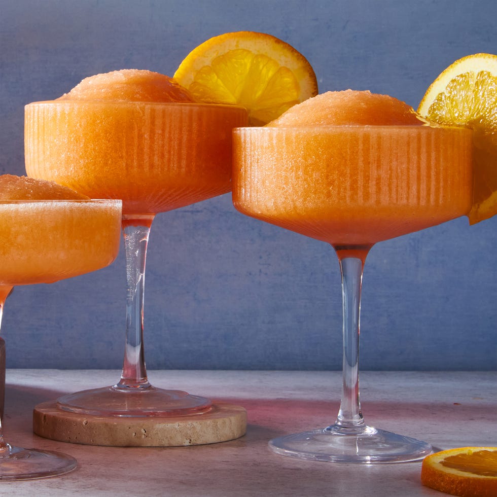 blended aperol spritz with an orange wheel garnish