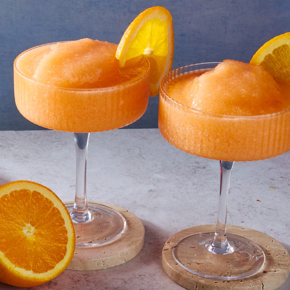 blended aperol spritz with an orange wheel garnish