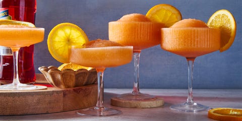 blended aperol spritz with an orange wheel garnish