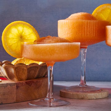 Aperol Spritz Slush blended aperol spritz with an orange wheel garnish