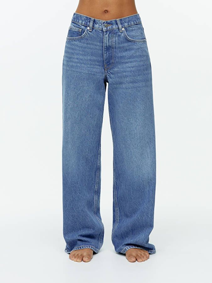 a person's legs and jeans