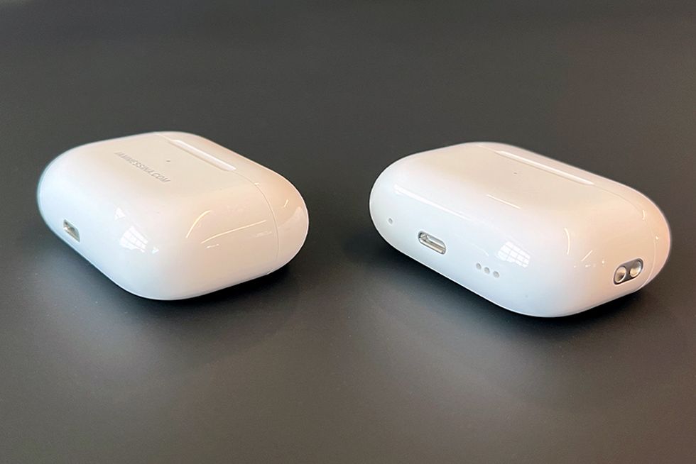 an older air pods case next to the generation 2 air pods case to show the differences