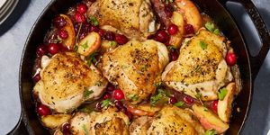 apple cranberry roasted chicken in a skillet