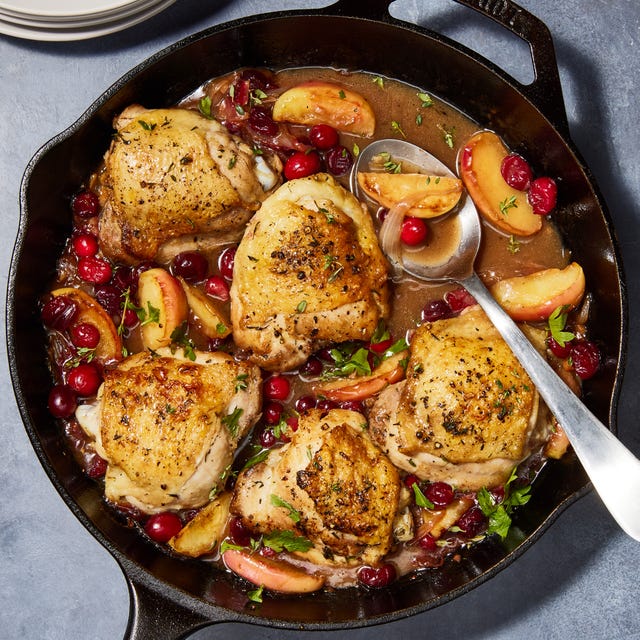 apple cranberry roasted chicken in a skillet