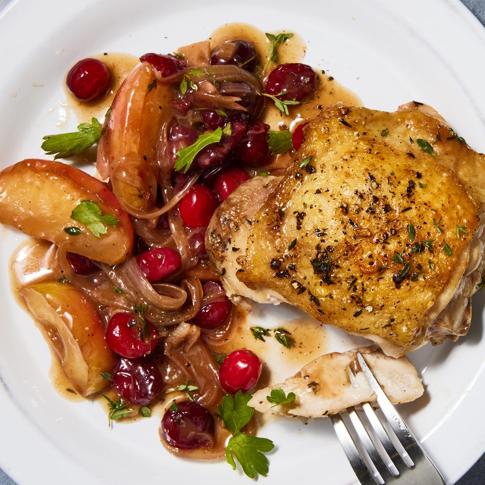 apple cranberry roasted chicken in a skillet