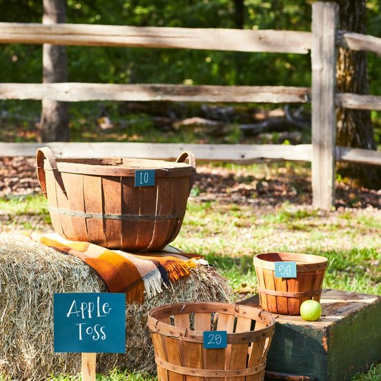 apple toss game with old fashioned bushel baskets