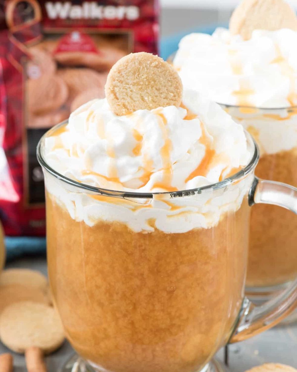 hot spiked caramel apple cider with whipped cream and cookie