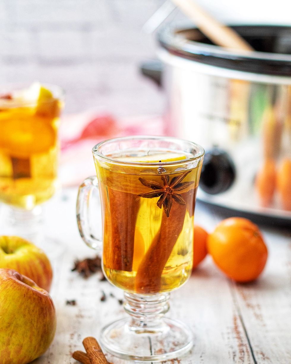slow cooker spiked apple cider in glass mug
