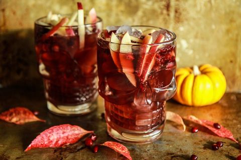 spiced apple cider pomegranate moscow mules in skeleton glasses
