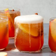 Apple Cider Spritz apple cider spritzes garnished with apples and cinnamon sticks
