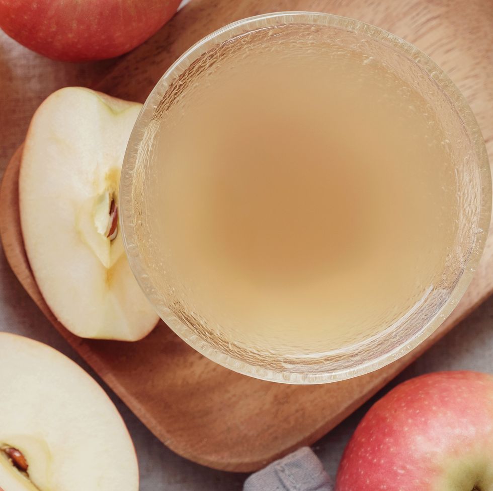Apple cider vinegar with mother in glass bowl, probiotics food for gut health