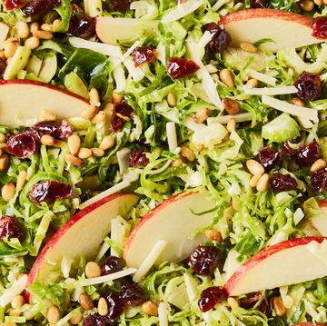 apple cranberry brussel sprout salad in a white bowl