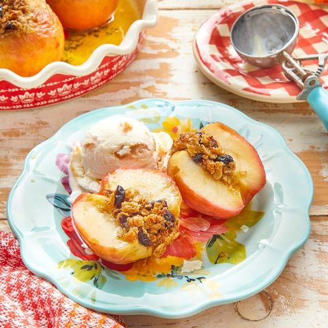 baked apples cut in half with ice cream on plate