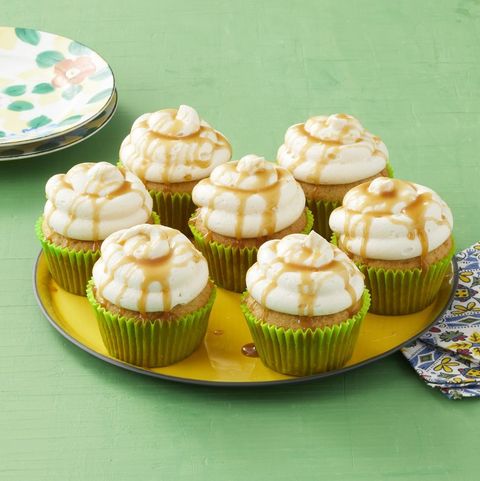 caramel apple cupcakes with green liners on green background