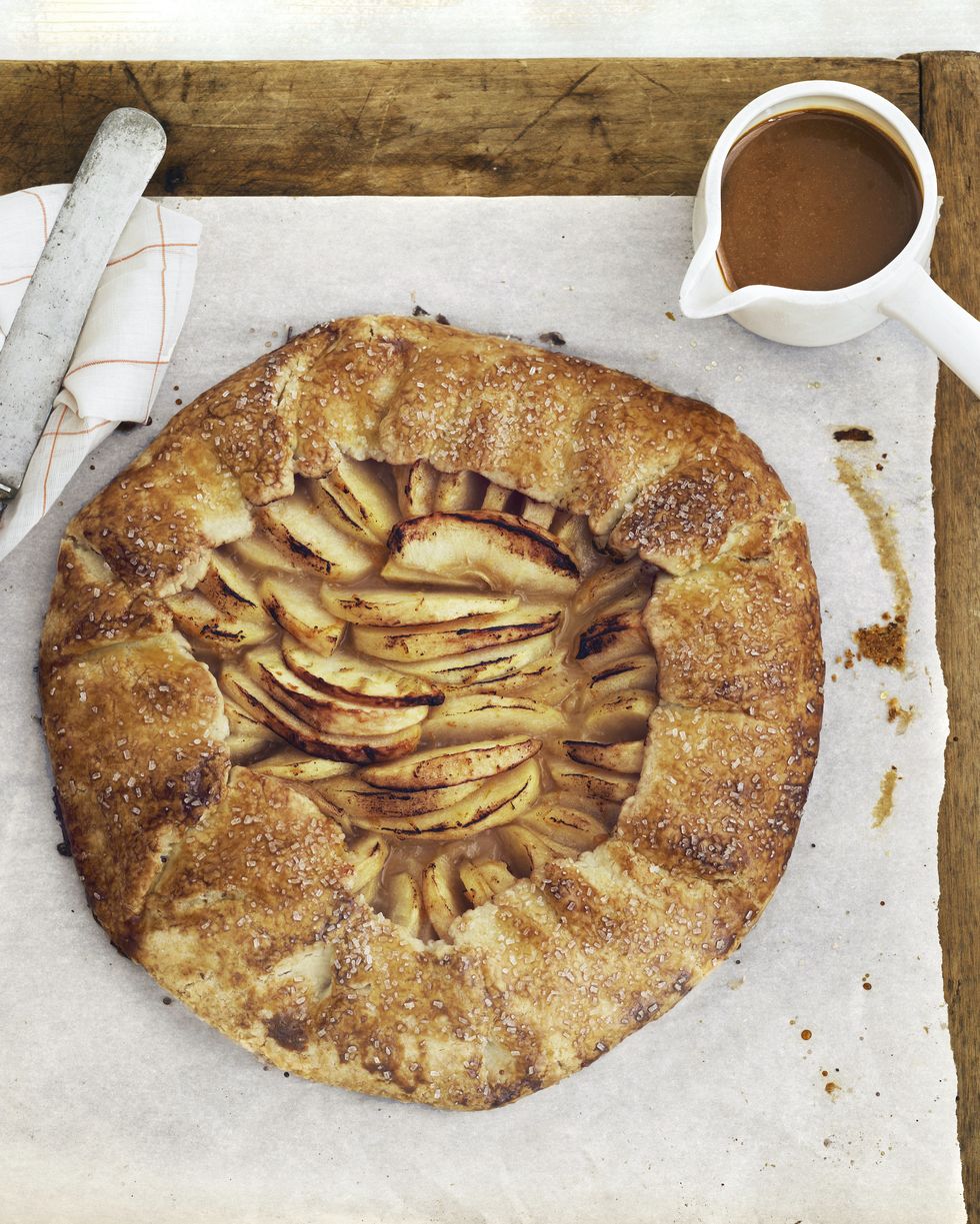 rustic apple galette on a parchment lined serving board