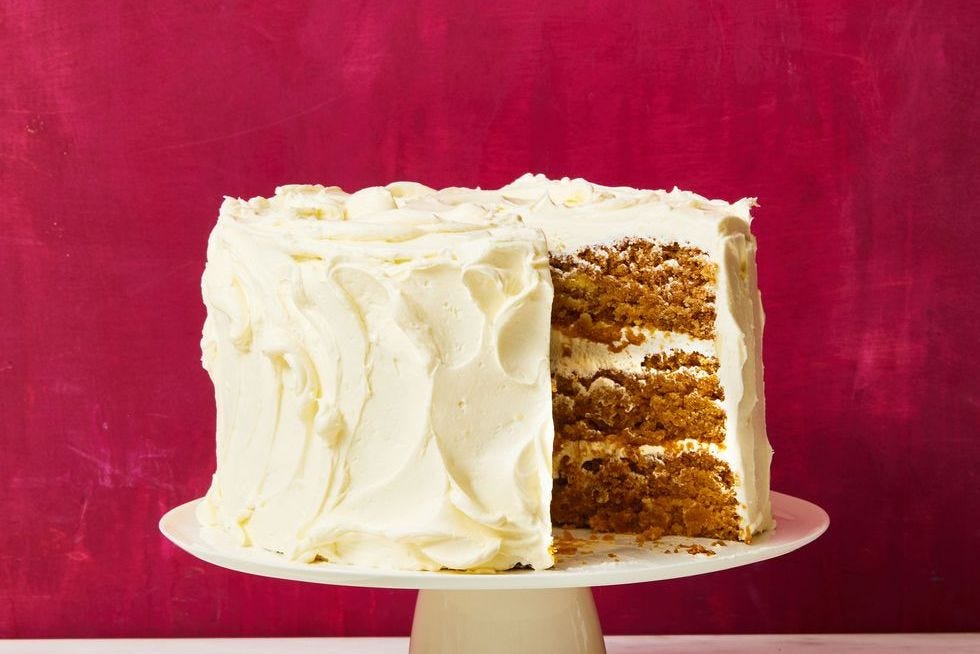vegan apple cake with white frosting on top