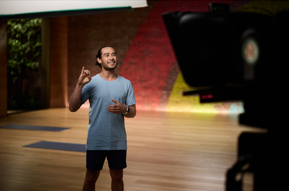 apple fitness instructor using american sign language