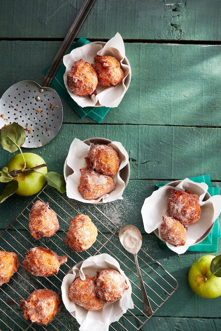 apple fritters dusted with cinnamon sugar on top