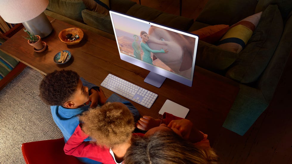 family engaging with animated content on a computer
