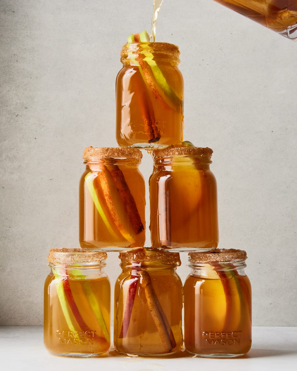 apple pie bourbon shots stacked in a pyramid