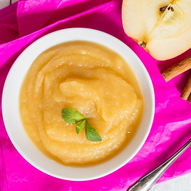 Applesauce on pink paper and spoon