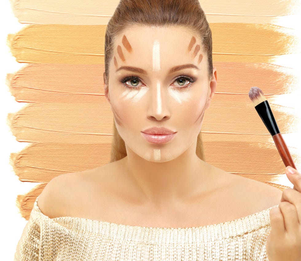 applying make up woman with a brush for make up