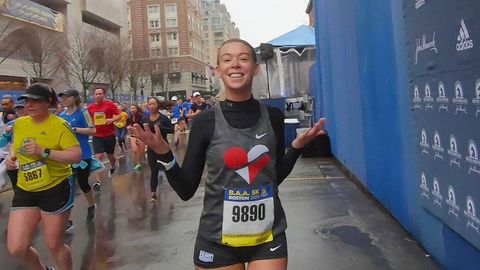 Adrianne Haslet crosses the Boston Marathon finish line during the 2019 BAA 5K.