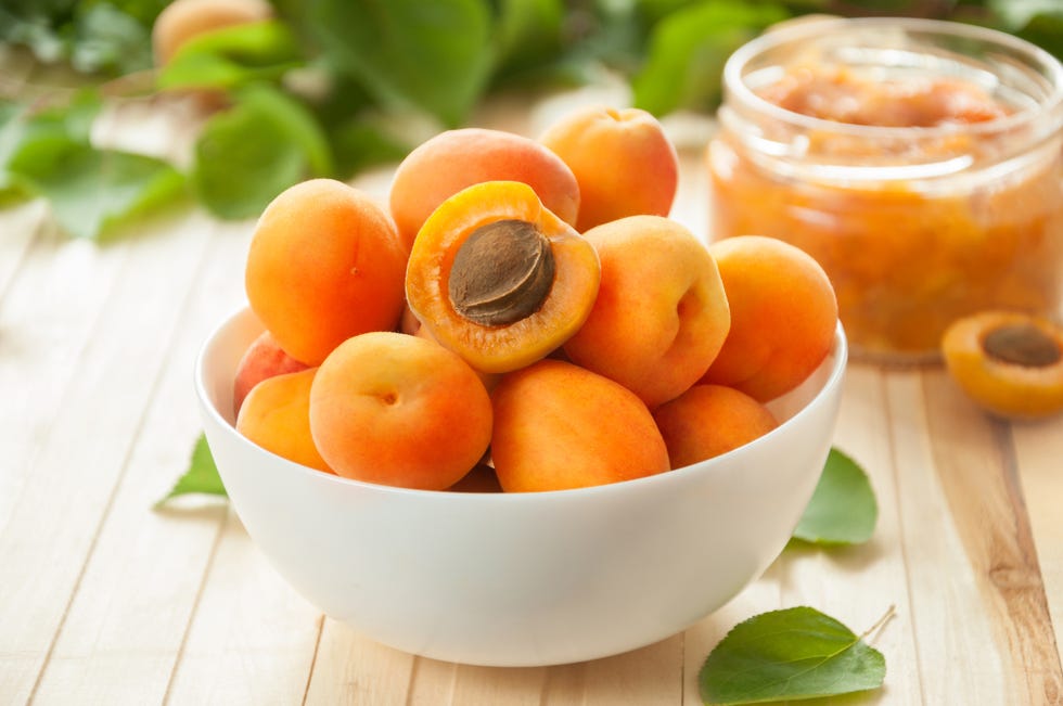 apricots in a bowl next to jam
