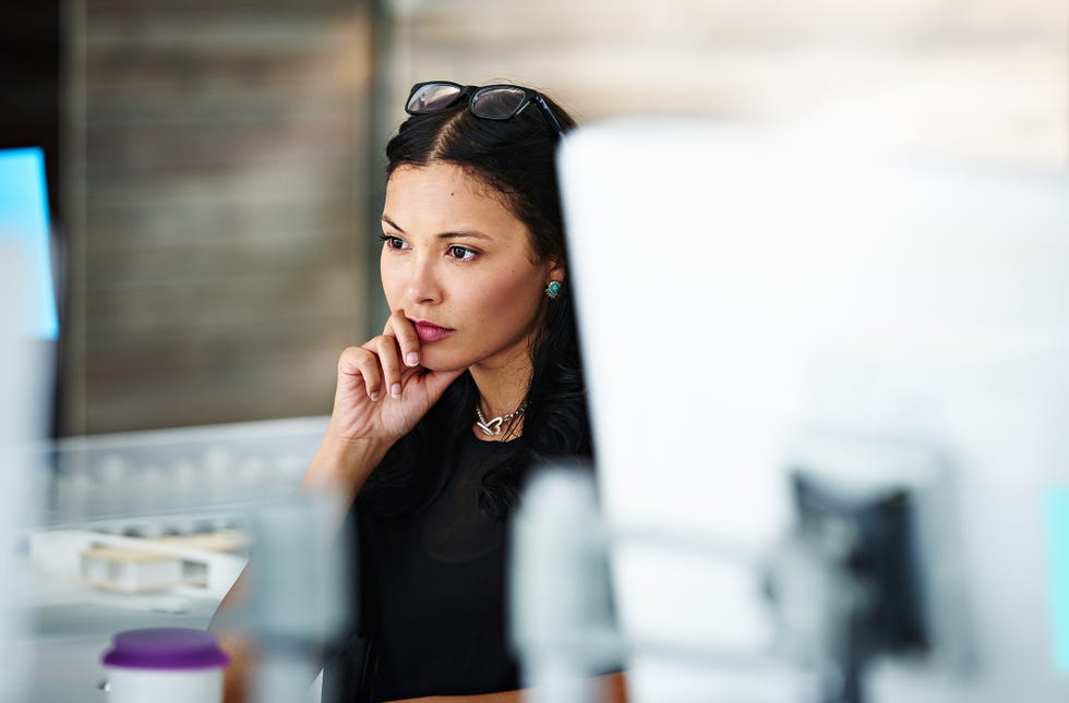 falling out of love woman staring into the distance with chin in hand