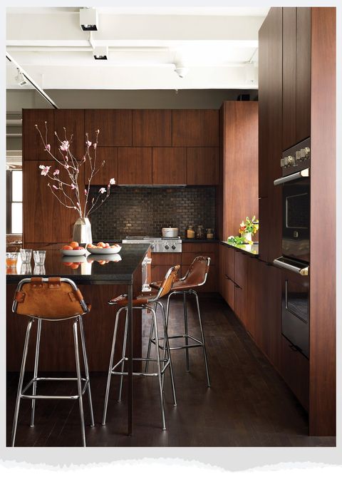 kitchen with dark wood cabinets and dark counters