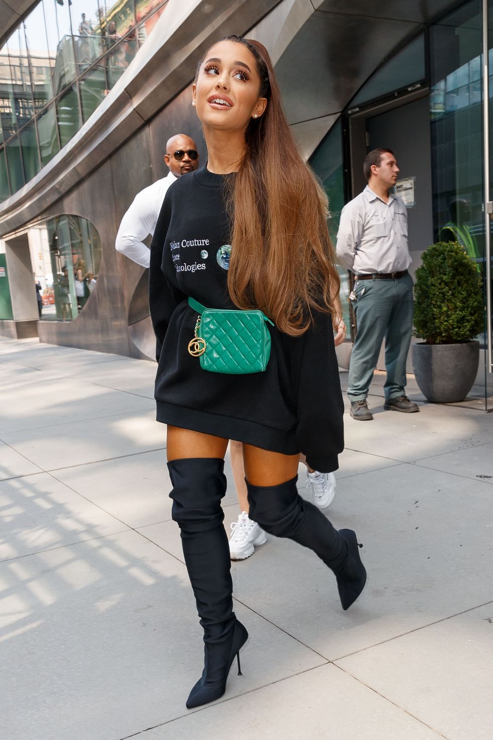 ariana grande wore a blue hoodie and knee high boots as she