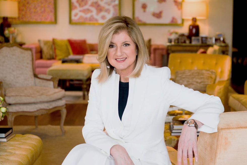 arianna huffington seated in an office