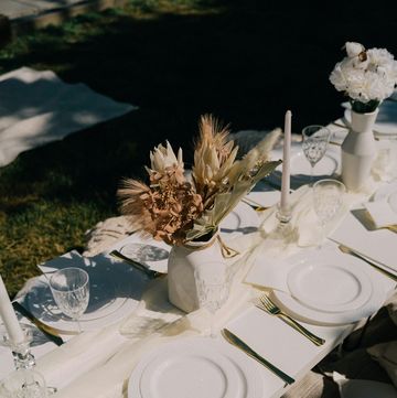 a table set with plates and silverware