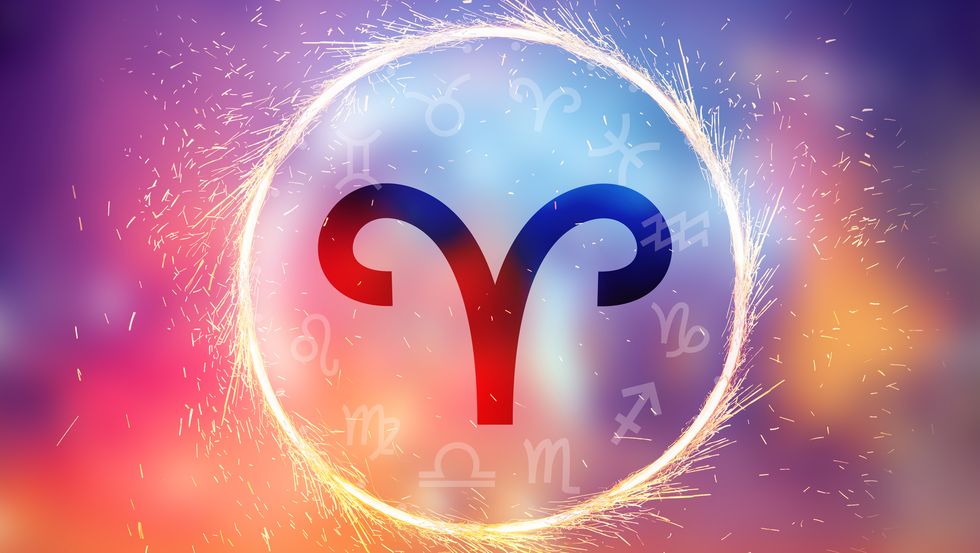 aries symbol on a colorful background light