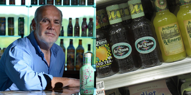 a man sitting at a table with bottles of alcohol
