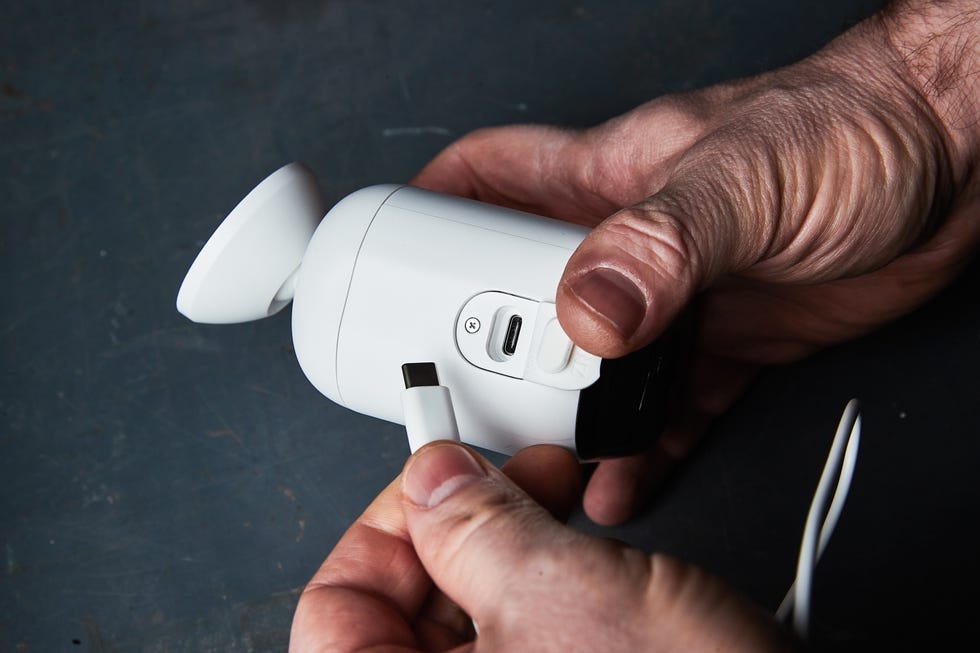 connecting a usb c cable to an arlo essential xl outdoor camera