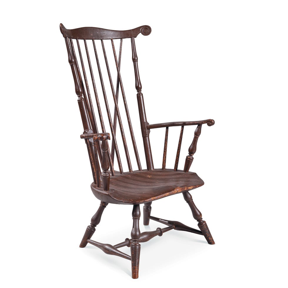 tall wooden chair with a slatted back and broad seat featuring turned armrests and legs