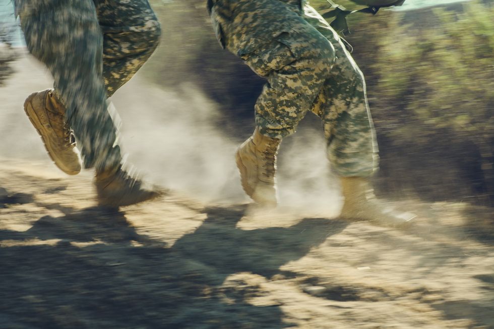 soldiers running shown from the legs down