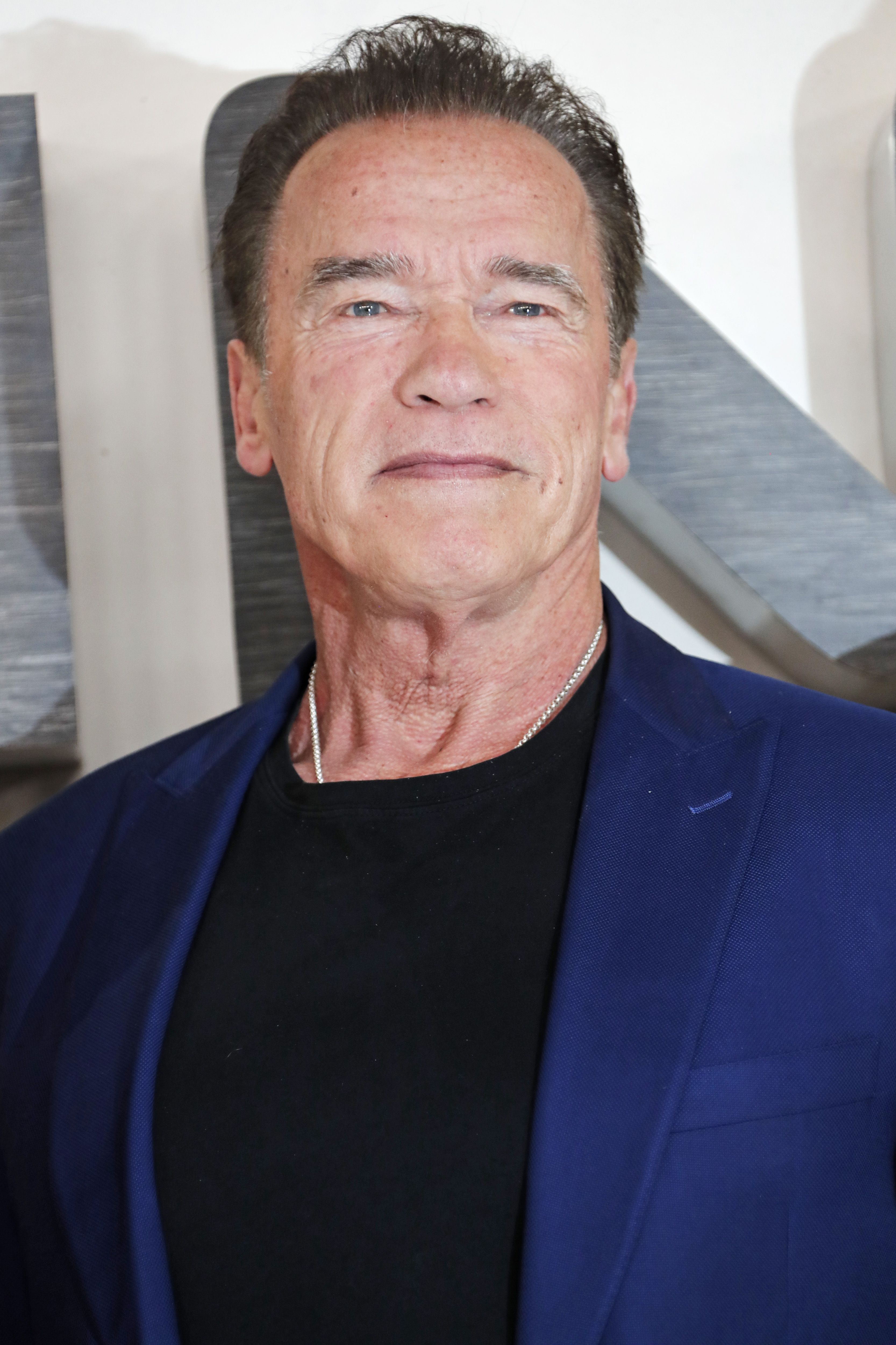 Watch Arnold Schwarzenegger Use Huge Scissors to Cut Son Patricks Hair