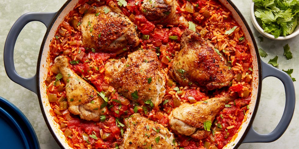 chicken thighs and legs in a tomato based rice