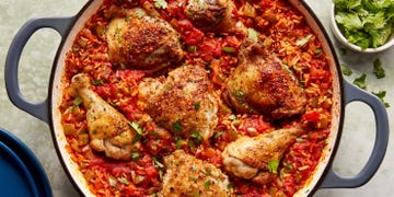 chicken thighs and legs in a tomato based rice