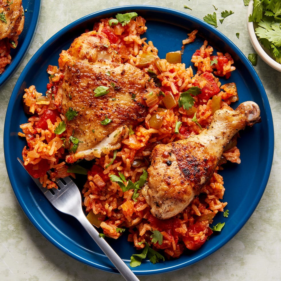 chicken thighs and legs in a tomato based rice