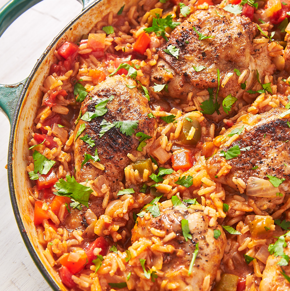 arroz con pollo in a teal dutch oven